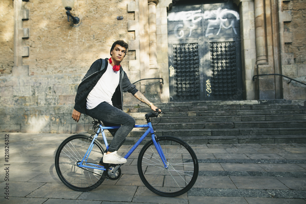 Teenager with a fixie bike in the city Teenager with a fixie bike in the city