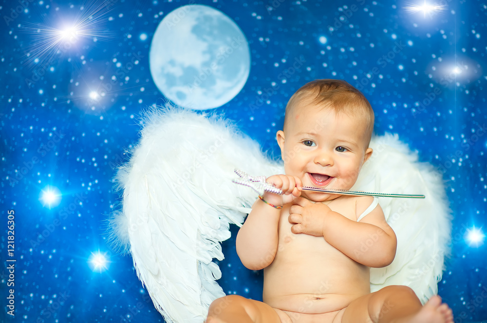 Baby a few months with a magic wand and angel wings Baby a few months with a magic wand and angel wings