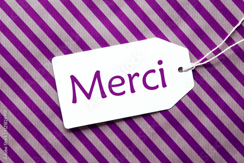 Label On Purple Wrapping Paper, Merci Means Thank You