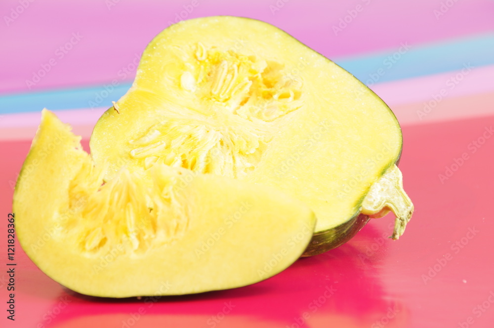 Yellow and ripe pumpkin lie on a bright background
Yellow and ripe pumpkin lie on a bright background