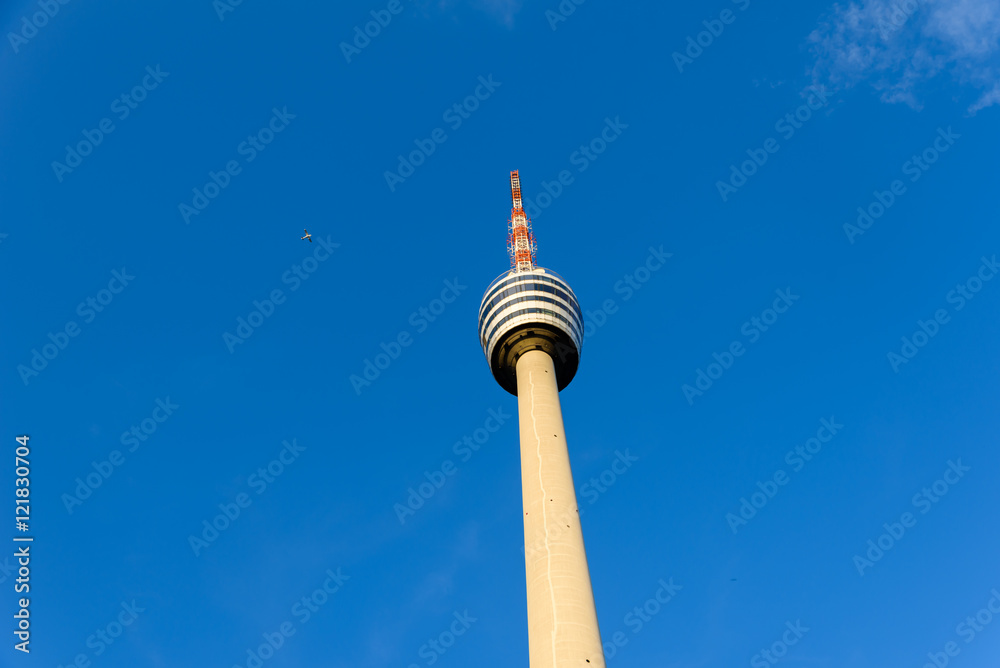 TV Tower in Stuttgart, Germany - First TV Tower of the world - Plane in the background TV Tower in Stuttgart, Germany - First TV Tower of the world - Plane in the background