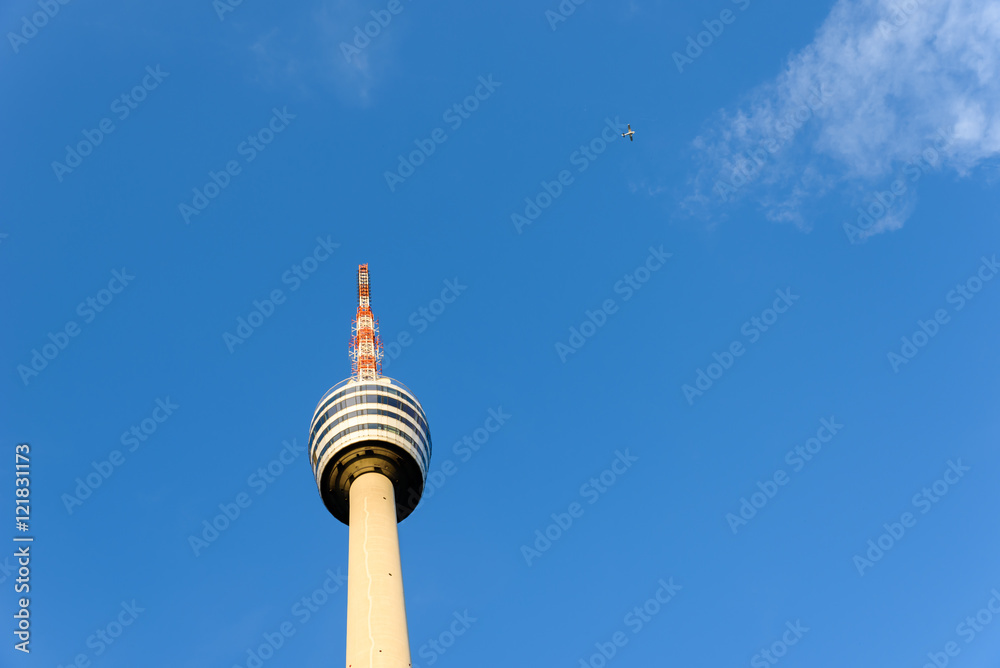 TV Tower in Stuttgart, Germany - First TV Tower of the world - Plane in the background TV Tower in Stuttgart, Germany - First TV Tower of the world - Plane in the background