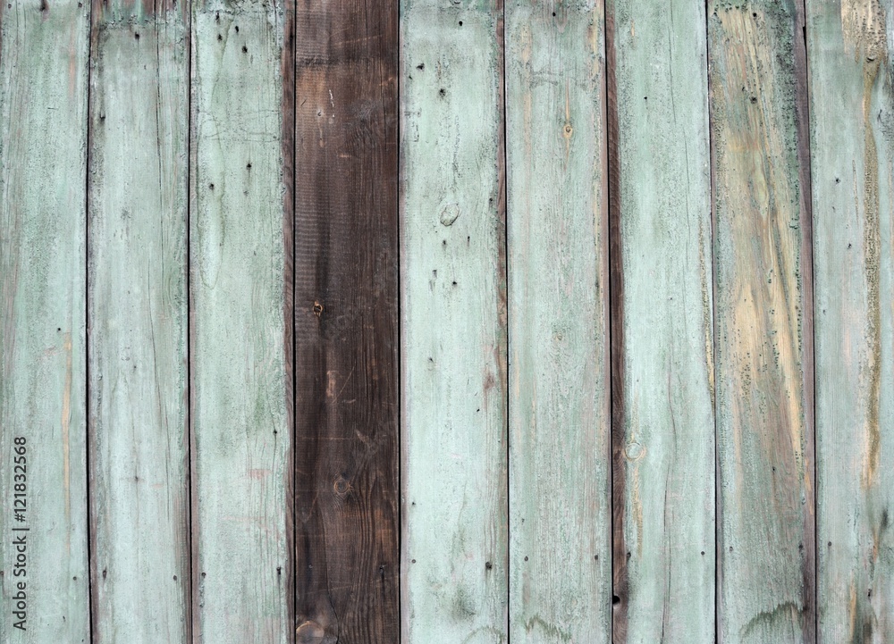 background consisting of old wooden boards with traces of peeling paint. partially tinted photo. background consisting of old wooden boards with traces of peeling paint. partially tinted photo.