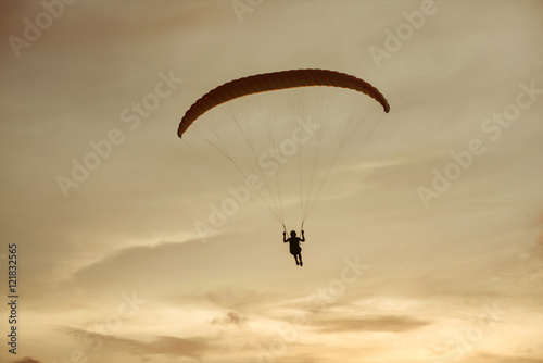 Paraglider flies on background of the sky