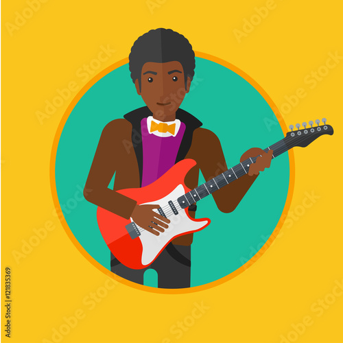 Musician playing electric guitar.