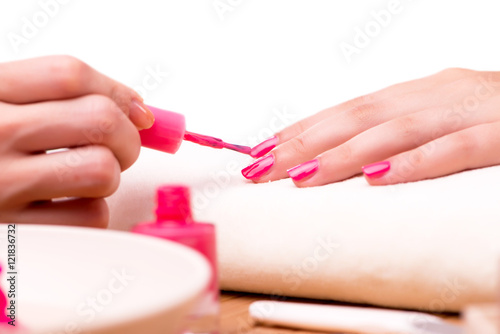 Young woman in nail treatment medical concept