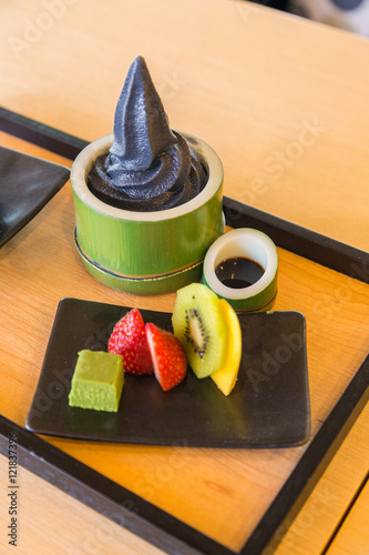 Charcoal vanilla soft cream with fruit platter.