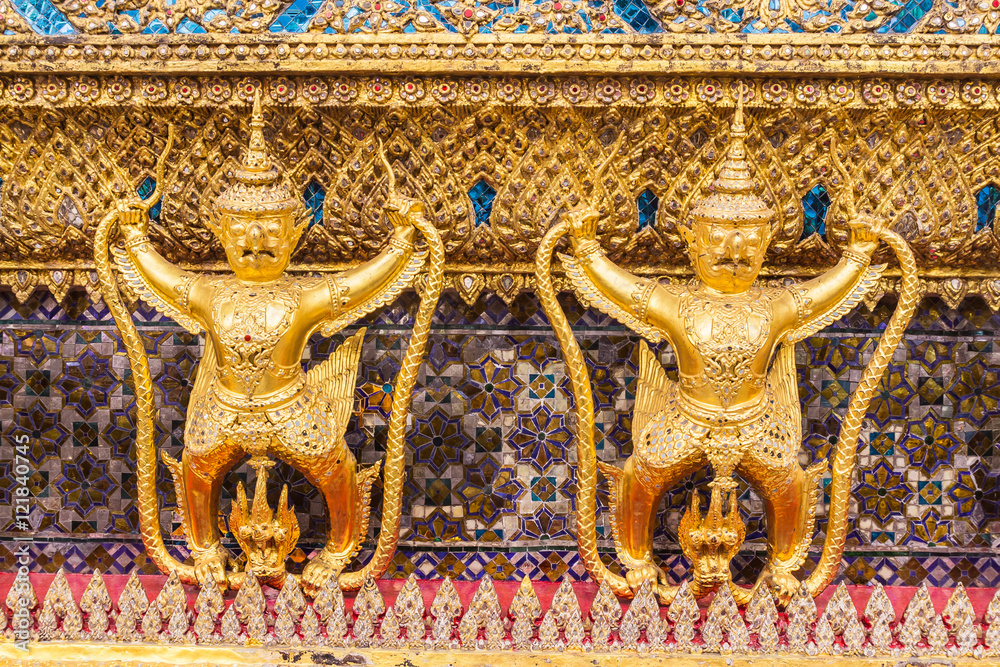 Golden garuda decoration on wall of main Buddhist church or 