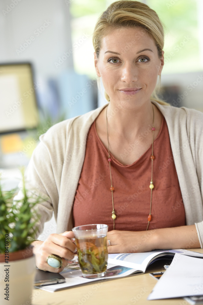 Attractive woman designer working from home-office