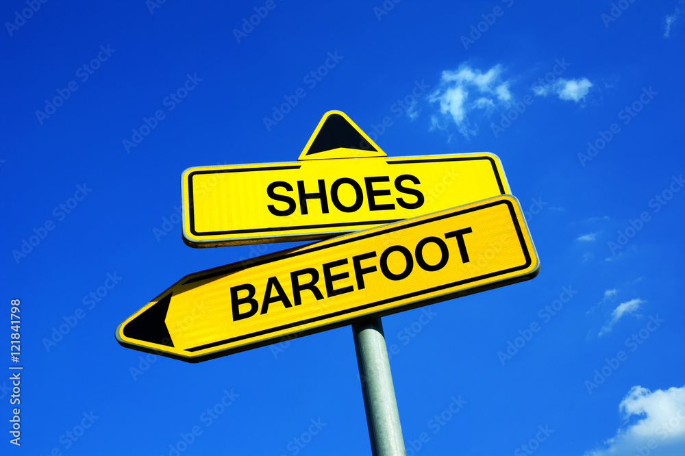 Obraz premium Shoes or Barefoot - Traffic sign with two options - being shod vs unshod during walking and running. Advantage and disadvantage of wearing footwear