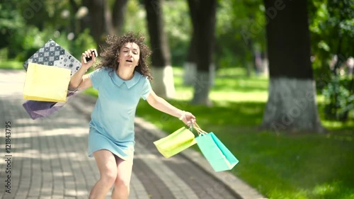 The girl walking along track and stumbles.