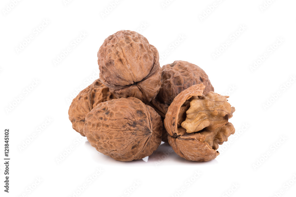 walnut and a cracked walnut isolated on the white background walnut and a cracked walnut isolated on the white background