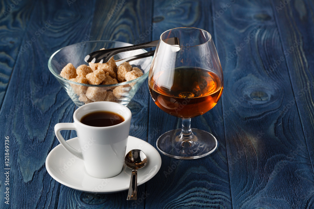 Close up a glass of cognac and coffee