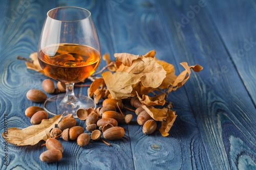 Photos Coffee and cognac on blue wood table