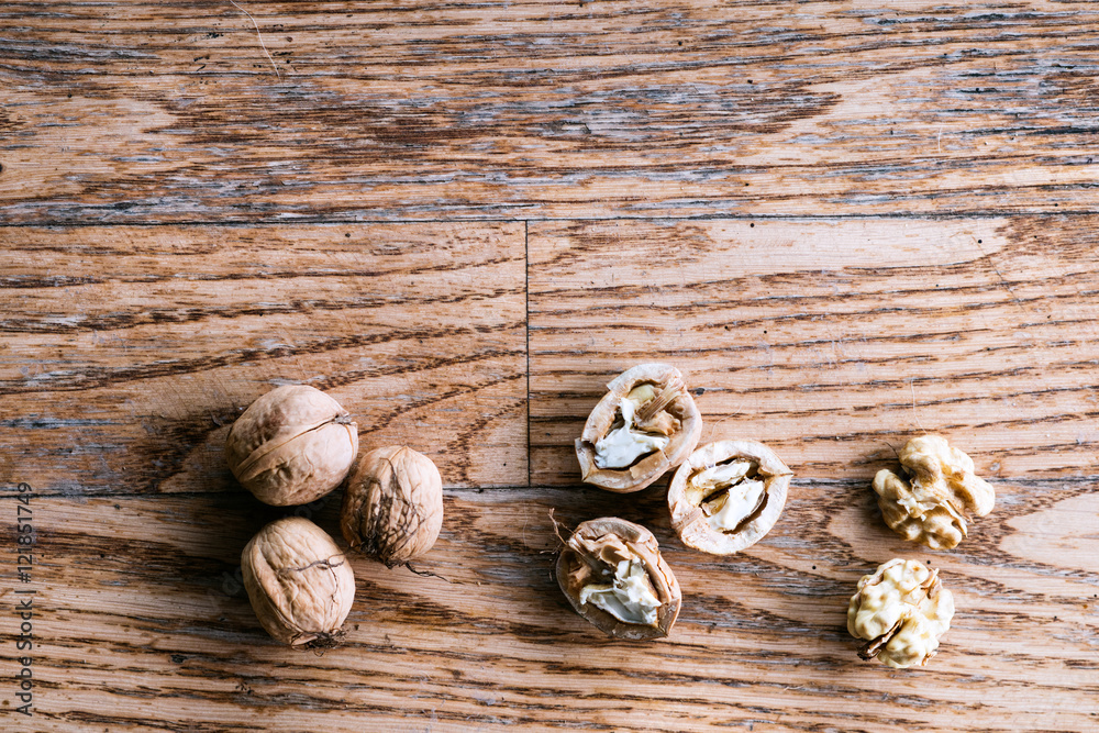 Walnuts on wooden background. Studio shot, copy space. Walnuts on wooden background. Studio shot, copy space.