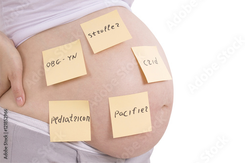 Рregnant belly and sticker notes (Clipping path) photo