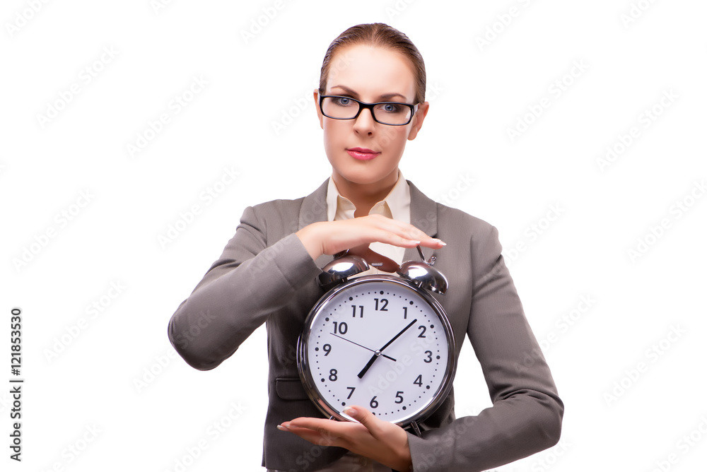 Businesswoman with giant alarm clock isolated on white Businesswoman with giant alarm clock isolated on white