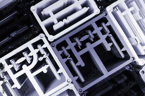 Stacks of molded plastic buttons for phones and tablets