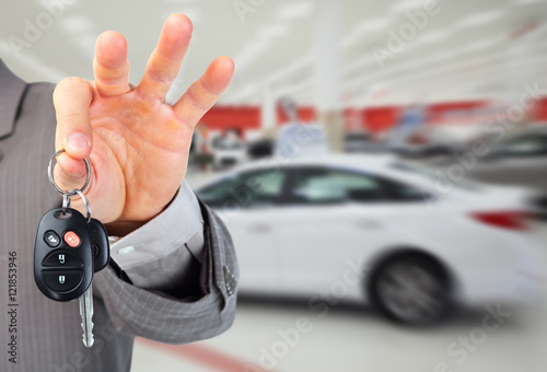 Dealer hand with a car key.