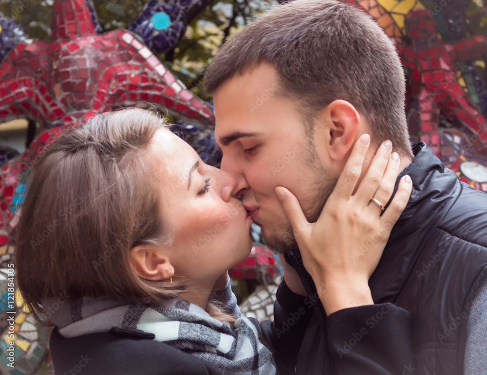 Fototapeta premium fashion of nice pretty young hipster woman with a handsome man kiss