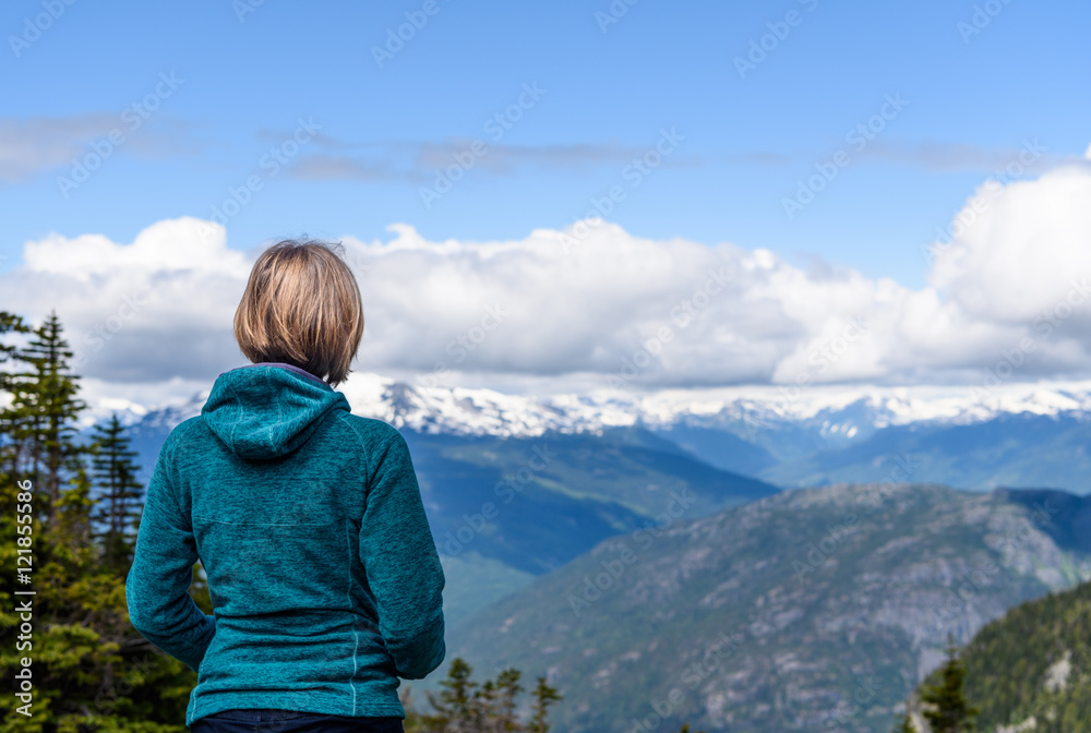 Traveler woman enjoying serene view mountains landscape Eco tourism concept. Lifestyle of hiking. Summer vacations outdoor.