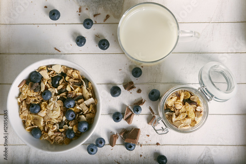 healthy breakfast composition with milk blueberry cereals and ch photo