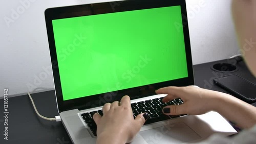 Young Assistant Working Hard At Her Laptop Early In The Morning  Green Screen
