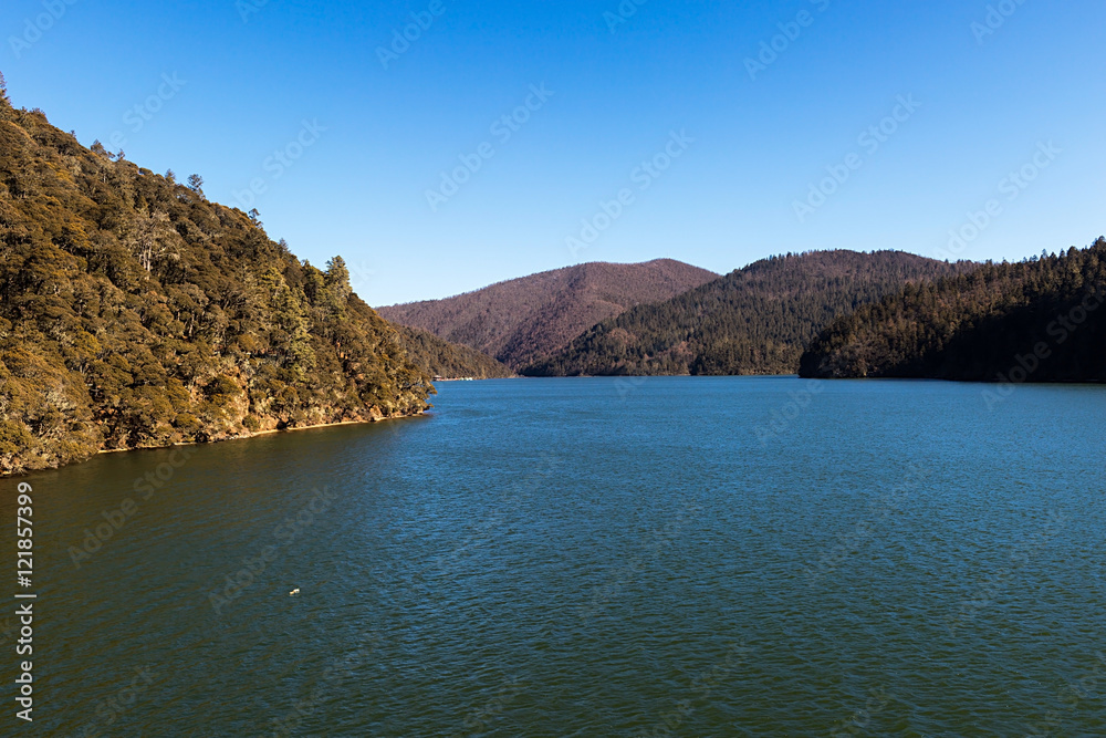 Bita Lake and mountain range in Pudacuo national Park located at Shangri-La (Zhongdian), Yunnan, China.