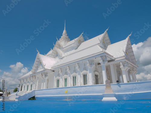  White Vihara hall boat style  in Wat Hin Thaen Lamphachi temple (Temple public) . Kanchanaburi ,Thailand photo