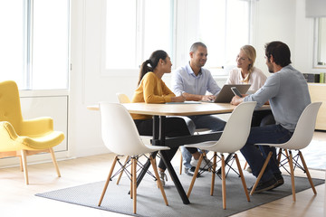 Business people meeting around table in office