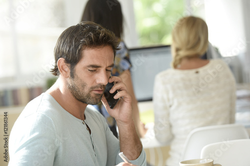 Office worker talking on phone