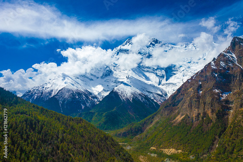 Landscape Snow Mountains Nature Viewpoint.Mountain Trekking Landscapes Background. Nobody photo.Asia Travel Horizontal picture. Sunlights White Clouds Blue Sky. Himalayas Rocks.