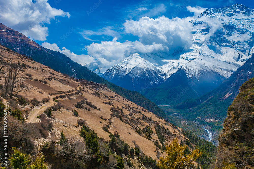 Beautiful Landscape View Snow Mountains Nature Viewpoint.Mountain Trekking Landscapes Background. Nobody photo.Asia Travel Sport.Horizontal picture. Sunlights White Clouds Blue Sky. Himalayas Rocks.