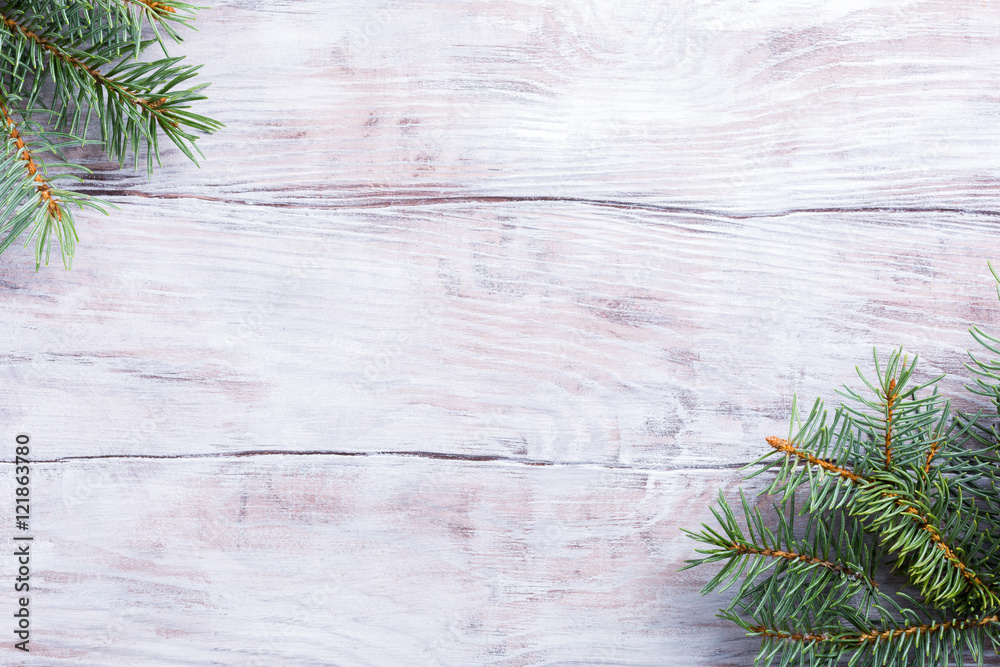 Christmas background with fir tree. Old wooden board. Top view with copy space for text. Christmas background with fir tree. Old wooden board. Top view with copy space for text.