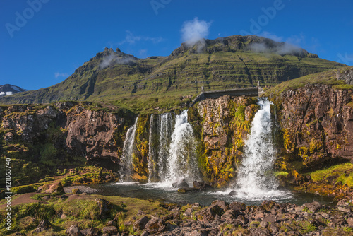 Wonderful waterfal Kirkjufellsfossl in Iceland in Autumn colors