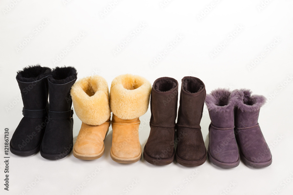 Different winter boots on a white background.
