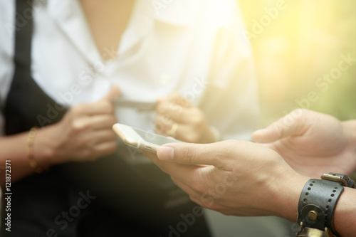 Man and woman making payment through smartphone and credit card  online payment concept