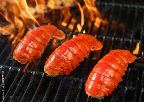 Lobster tails cooking on grill