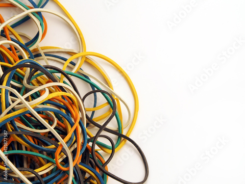 many multi coloured elastic rubber bands on white