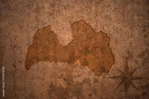 latvia map on vintage crack paper background