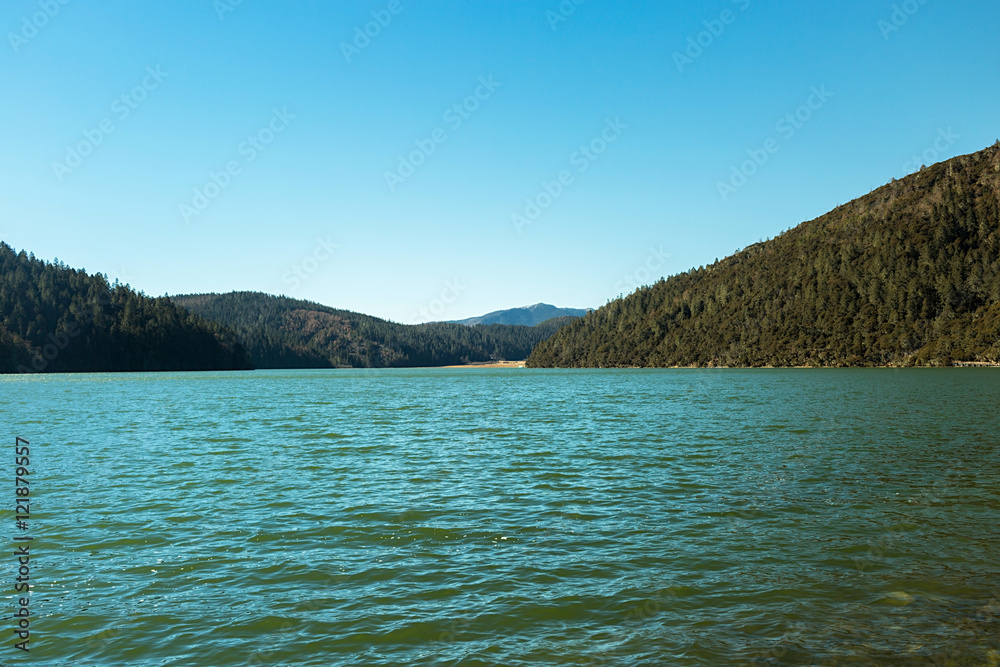 Bita Lake and mountain range in Pudacuo national Park located at Shangri-La (Zhongdian), Yunnan, China.