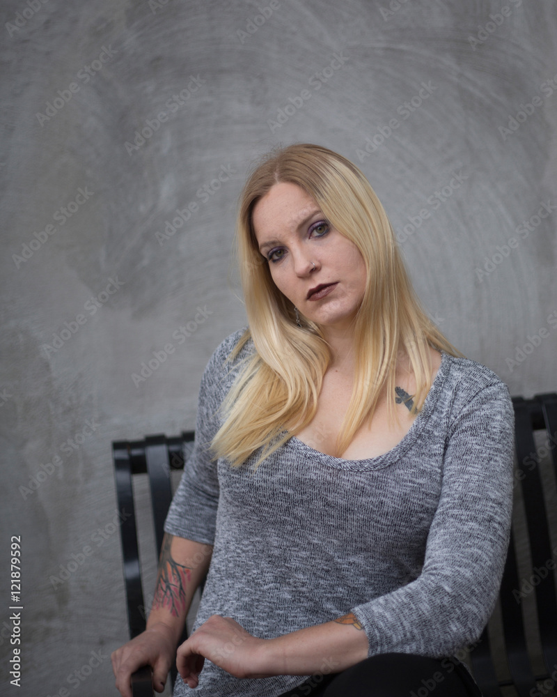 Fototapeta premium Young blonde woman outdoors in an urban environment
