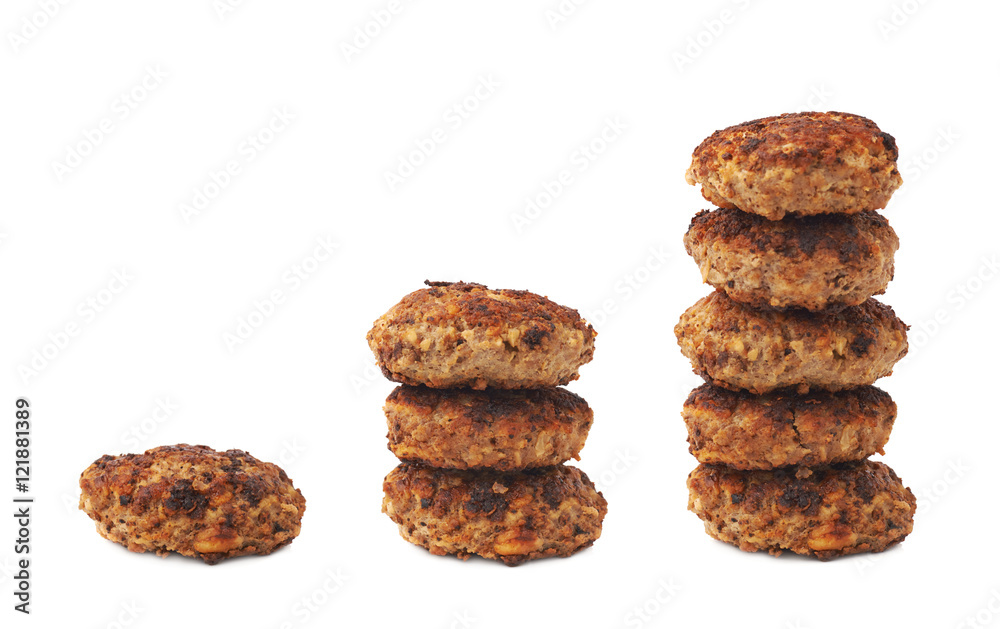 Stack of small hand made cutlets isolated over white background Stack of small hand made cutlets isolated over white background