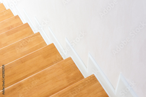 The modern wooden stair way in home close up.