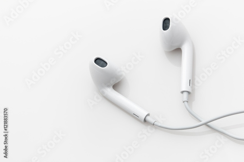 White ear buds on a white background.