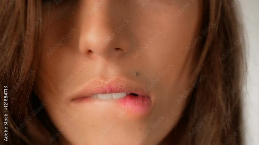 Fragment of female face, sexy lips with botox closeup