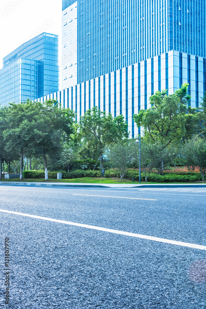clean asphalt road through office block area,suzhou,china.