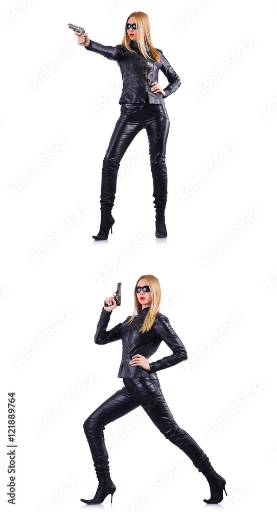 Woman in leather costume with gun isolated on white Woman in leather costume with gun isolated on white