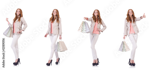 Young woman with shopping bags isolated on white