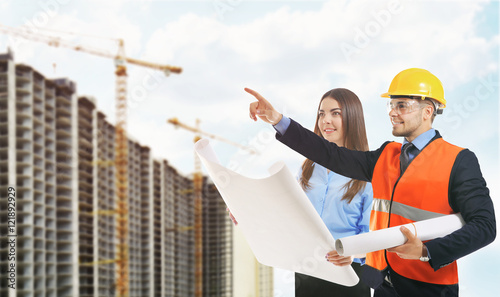 Woman and engineer in vest ...
